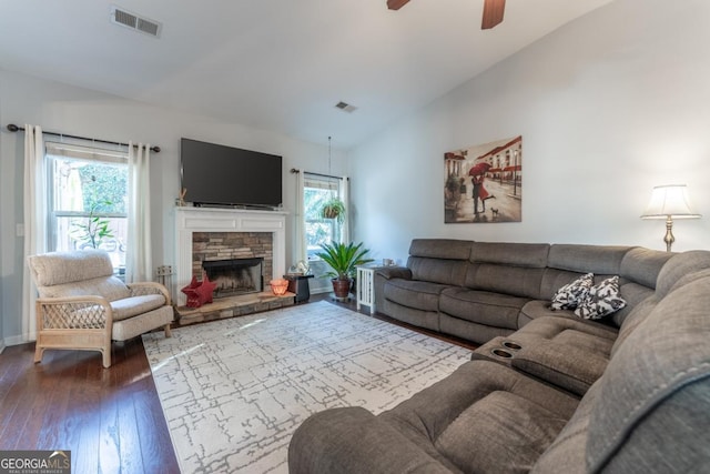 living room featuring hardwood / wood-style floors, vaulted ceiling, plenty of natural light, and ceiling fan