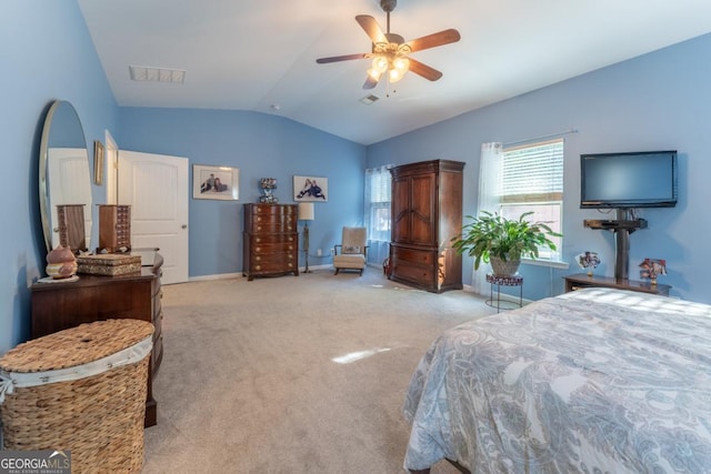 carpeted bedroom featuring ceiling fan and vaulted ceiling