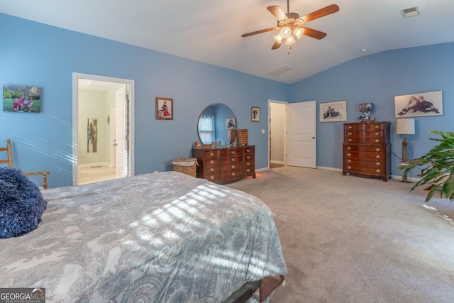 carpeted bedroom with ceiling fan, lofted ceiling, and ensuite bathroom