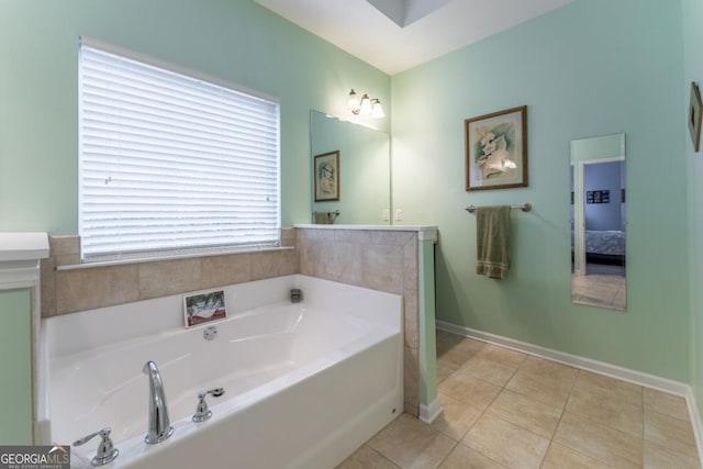 bathroom with tile patterned floors, vanity, and a bathing tub