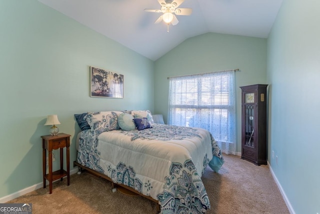 bedroom featuring ceiling fan, light carpet, and vaulted ceiling