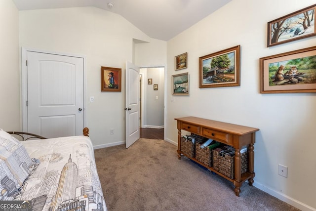 bedroom featuring light colored carpet and lofted ceiling