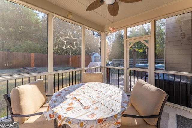 sunroom / solarium with ceiling fan