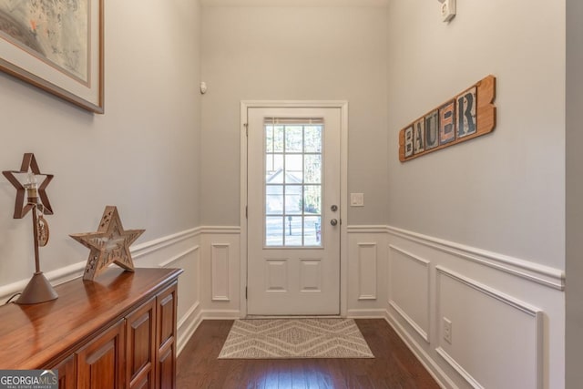 doorway with dark hardwood / wood-style floors