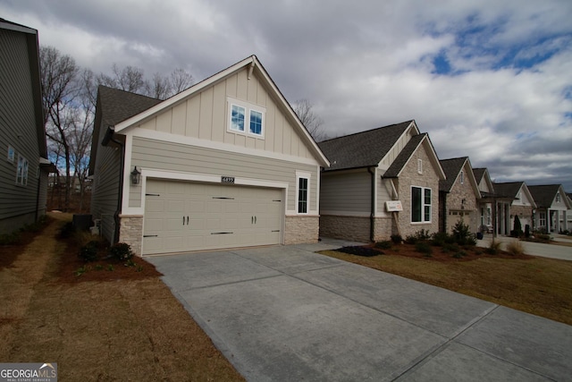 craftsman inspired home featuring driveway, a garage, board and batten siding, and stone siding