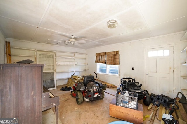 interior space with ceiling fan