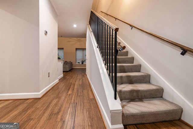 staircase featuring hardwood / wood-style flooring