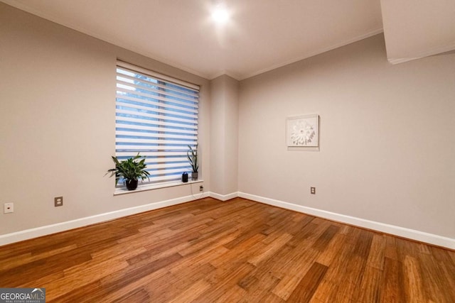 spare room featuring hardwood / wood-style flooring