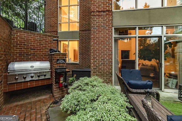 view of patio / terrace featuring area for grilling and an outdoor kitchen