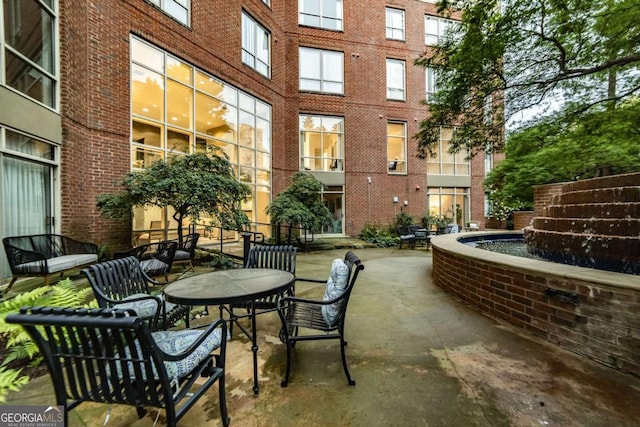 view of patio with pool water feature