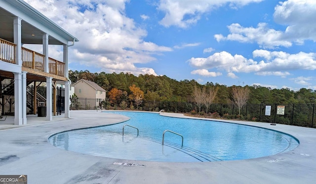 view of swimming pool featuring a patio