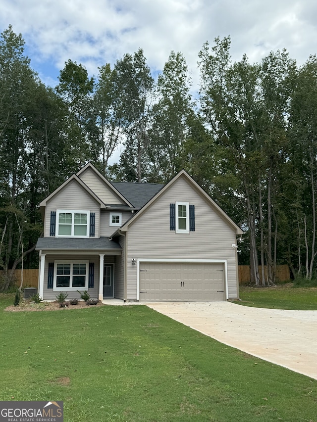 view of front of house featuring a front yard and a garage