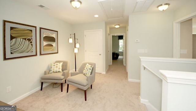 living area with light colored carpet