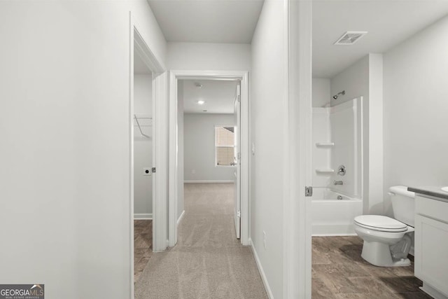 full bathroom featuring vanity, toilet, and bathtub / shower combination