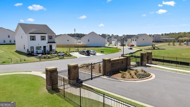 view of home's community with a yard