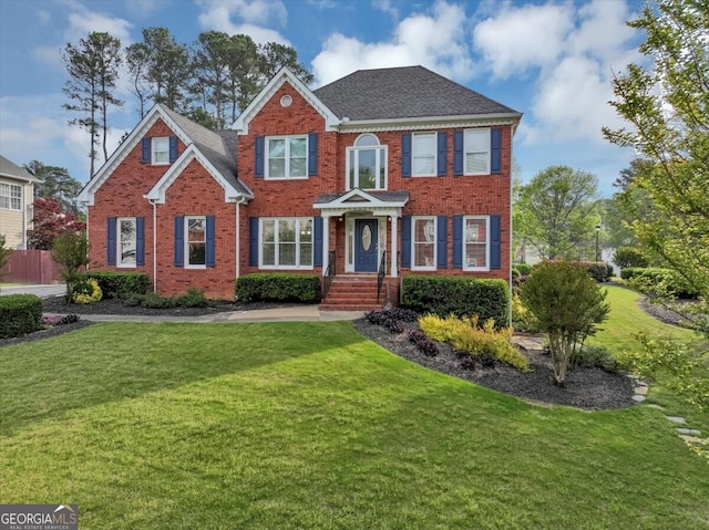 colonial inspired home with a front yard