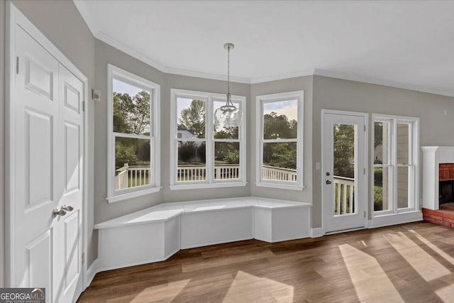 interior space with plenty of natural light and a brick fireplace