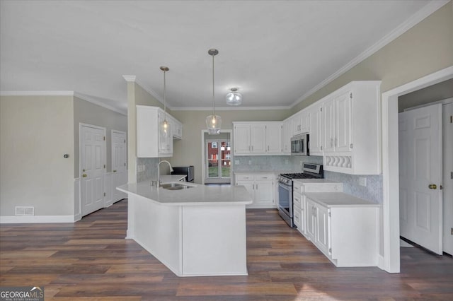 kitchen with sink, hanging light fixtures, dark hardwood / wood-style floors, white cabinetry, and stainless steel appliances