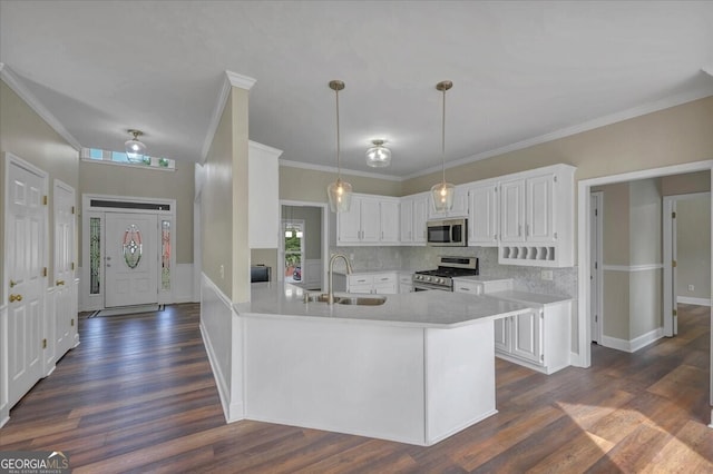 kitchen with white cabinets, sink, and appliances with stainless steel finishes