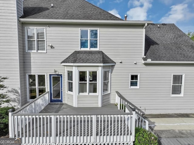 rear view of house with a deck