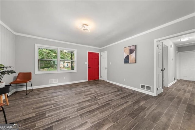 entrance foyer featuring crown molding and dark wood-type flooring