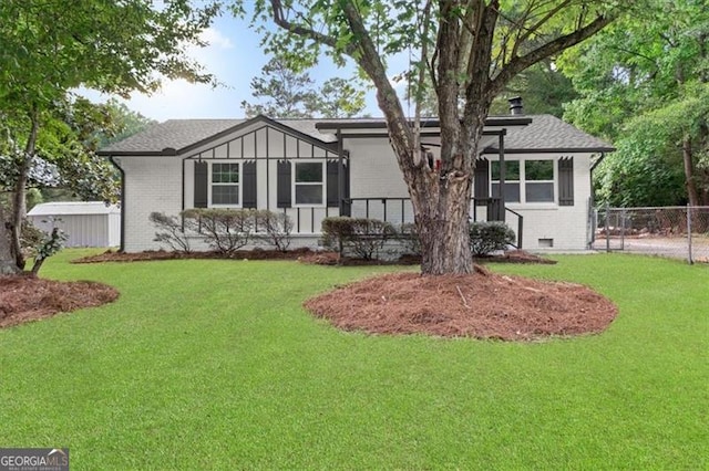 rear view of house with a lawn