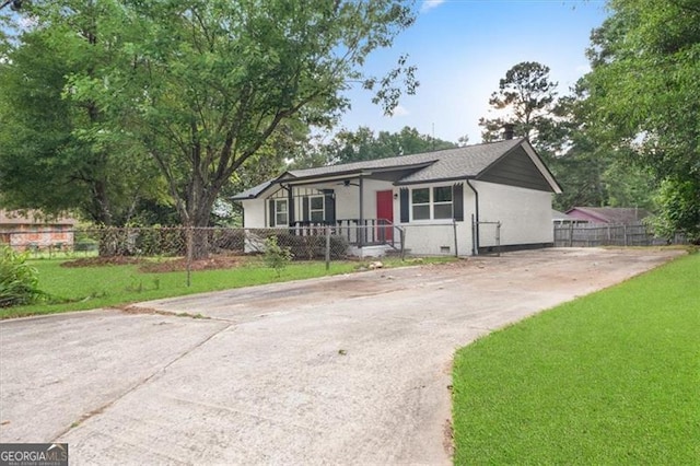 ranch-style house with a front lawn