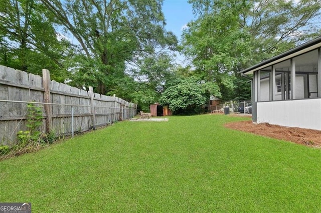 view of yard featuring a sunroom