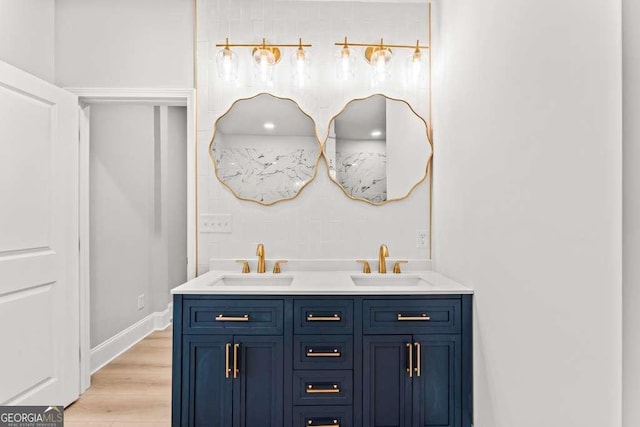 bathroom featuring hardwood / wood-style floors and vanity