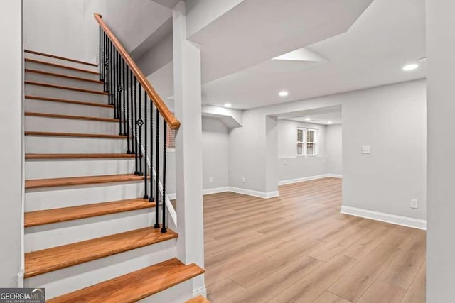 stairs with wood-type flooring