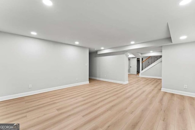 basement featuring light wood-type flooring