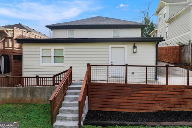 rear view of property with a deck