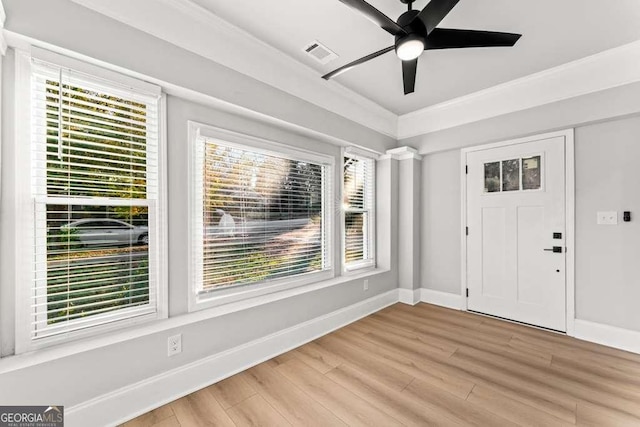 foyer with ceiling fan and light hardwood / wood-style floors