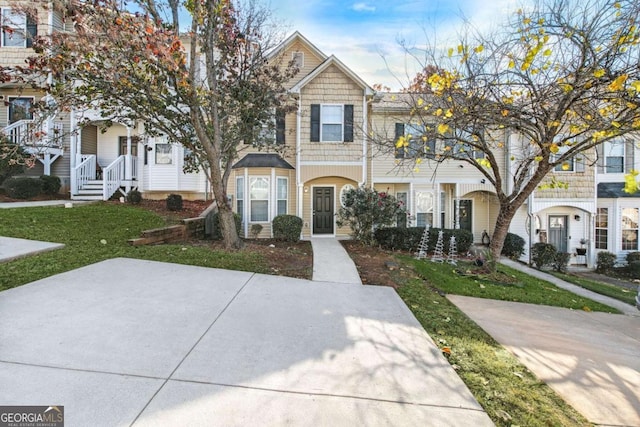 view of property with a front lawn