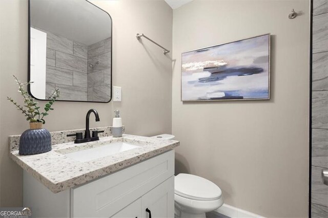 bathroom with vanity and toilet