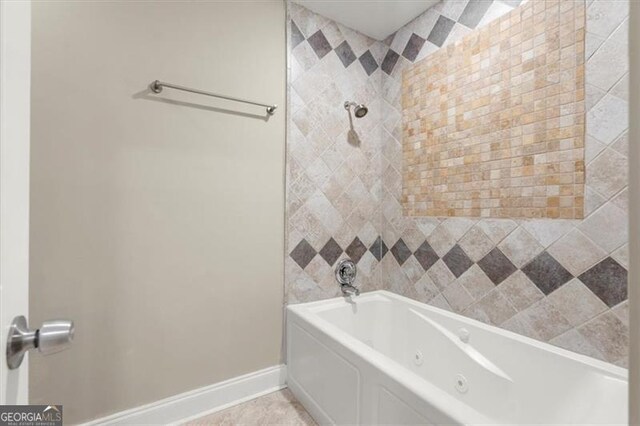 bathroom with tile patterned flooring and tiled shower / bath combo