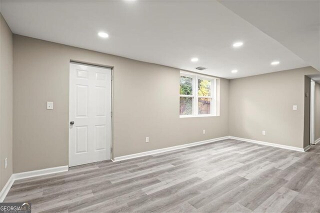 unfurnished room with light hardwood / wood-style flooring