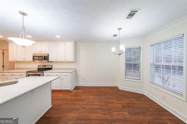 kitchen featuring dark wood-type flooring, crown molding, decorative light fixtures, white cabinetry, and stainless steel appliances