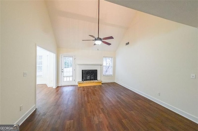 unfurnished living room featuring dark hardwood / wood-style floors, ceiling fan, and high vaulted ceiling