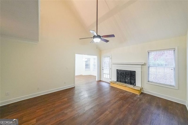 unfurnished living room featuring dark hardwood / wood-style floors, high vaulted ceiling, and ceiling fan