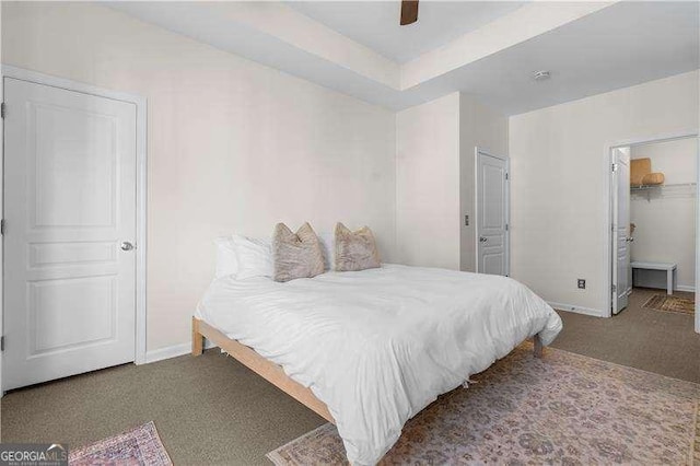 carpeted bedroom with a closet and ceiling fan