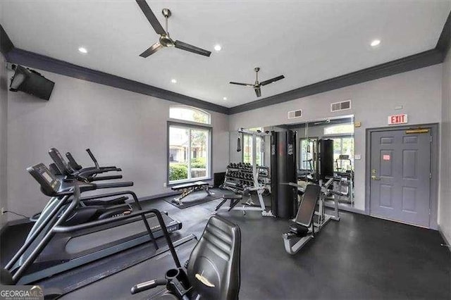 workout area featuring ceiling fan and ornamental molding