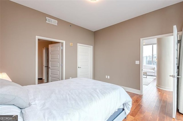 bedroom with wood-type flooring