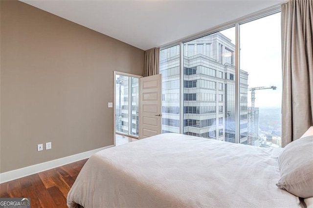 bedroom featuring dark hardwood / wood-style flooring