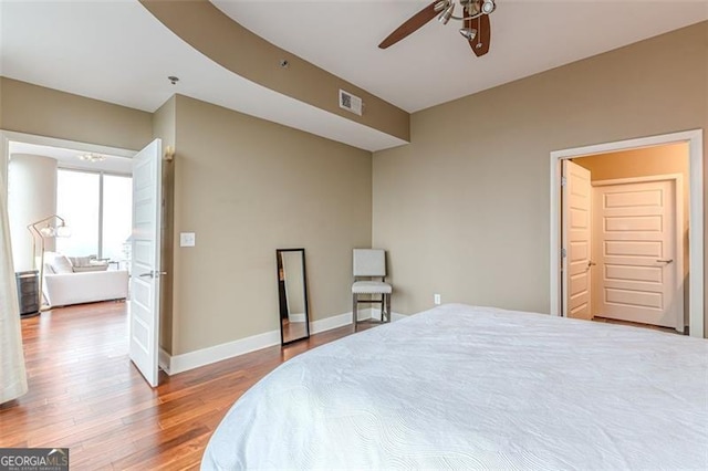 bedroom with hardwood / wood-style flooring and ceiling fan