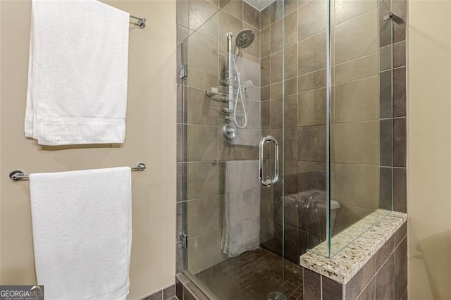 bathroom featuring an enclosed shower