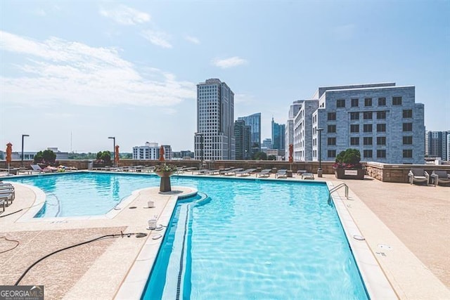 view of swimming pool featuring a patio area