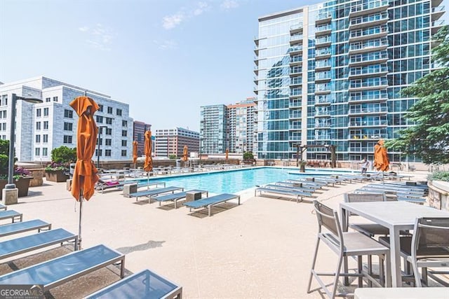 view of pool featuring a patio area