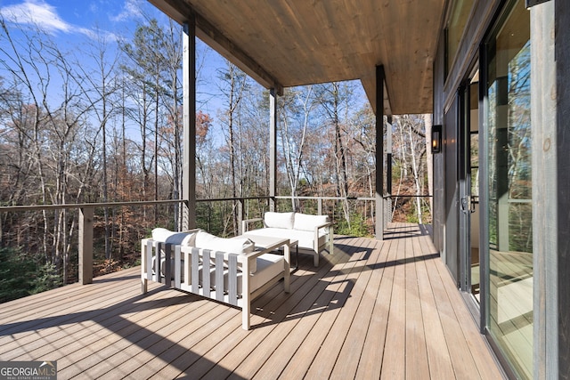 wooden deck with an outdoor hangout area