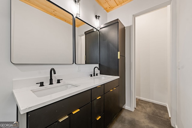 bathroom with concrete flooring and vanity